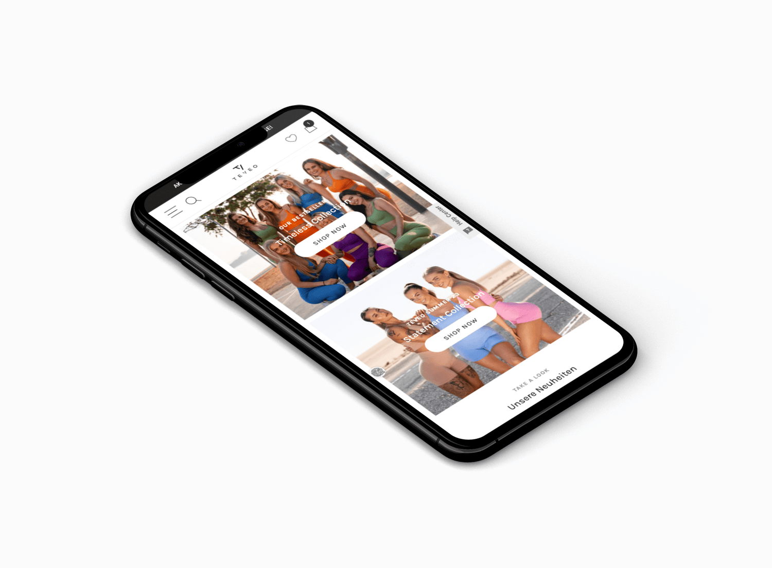 Schräg liegendes schwarzes Smartphone zeigt Website mit Frauen in bunten Sportoutfits am Strand